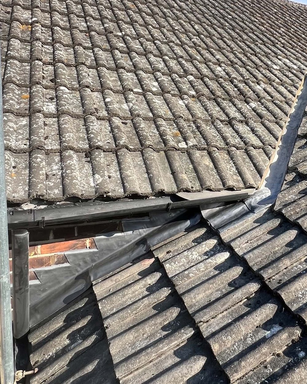 Lead valley after: finished lead flashing and valley on a tiled roof